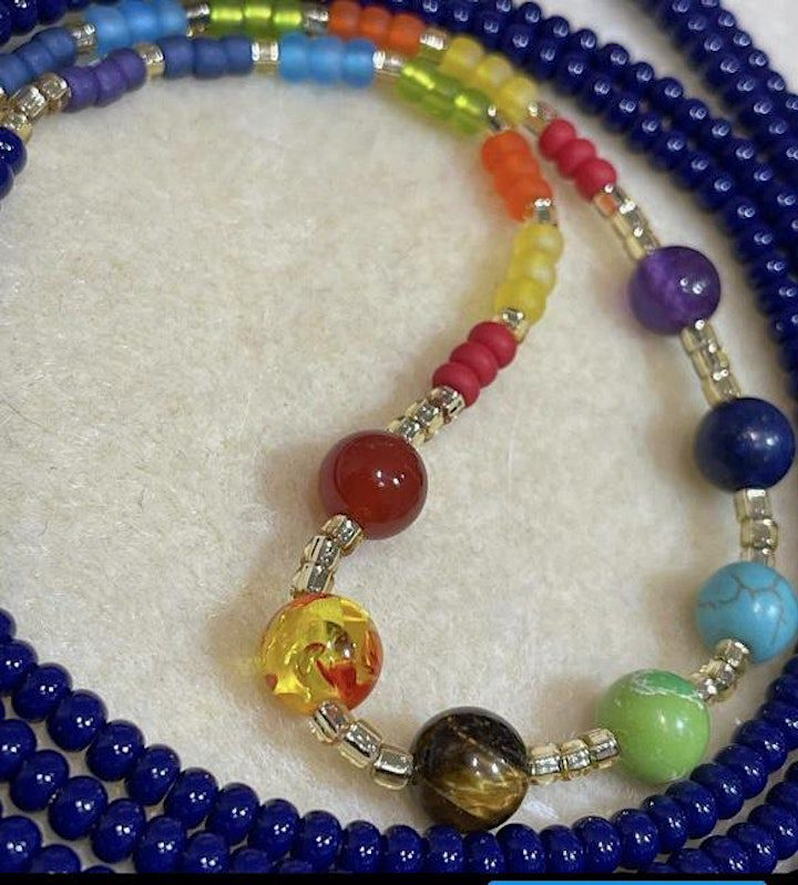 A necklace with many different colored beads on it.