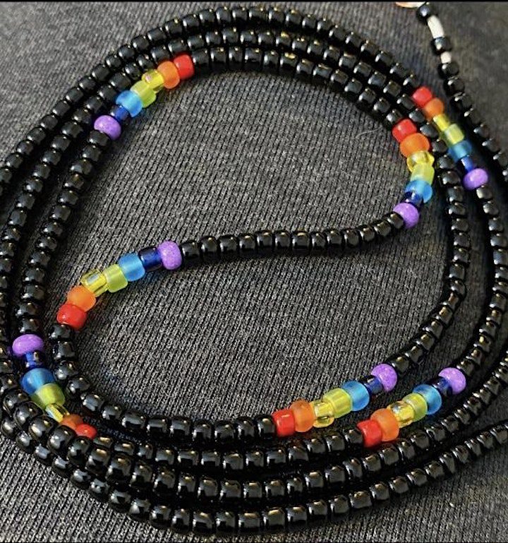 A close up of a necklace with beads